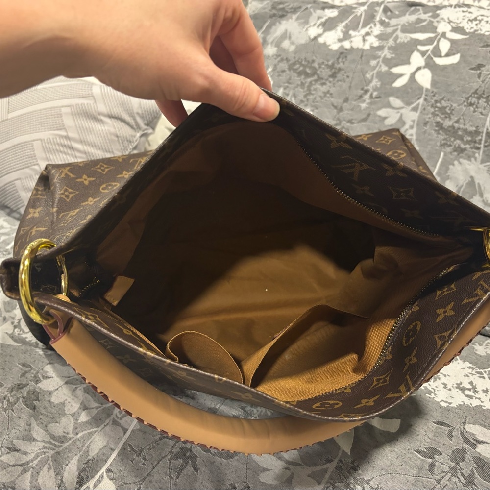 Louis Vuitton large purse.